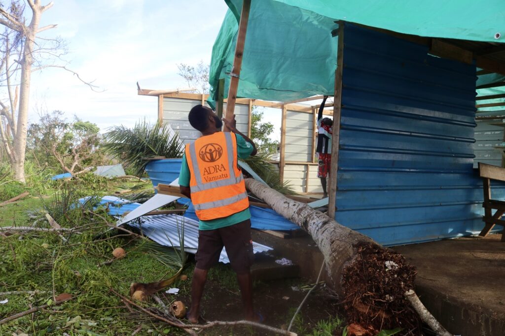 ADRA Vanuatu staff member assesses the damage.