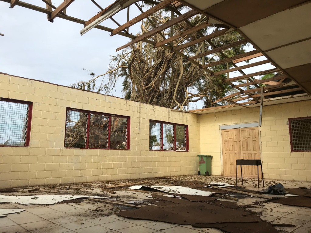 The roof of this boy's dormitory was torn off during the storm.